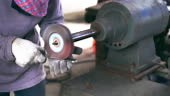 Footage scene Closeup of Angle Grinder hand holding and Grinding the...