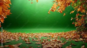Fallen leaves cover the ground in front of a green backdrop