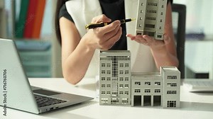 Female Asian home sales agent introduces home samples to customers online, successful female real estate agent, home sales