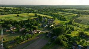 Rural landscape. Country houses in countryside. Village Home in Country. Wooden house in Russian villag. Agricultural field with Suburban house. Rural building in countryside. Roofs of village home.