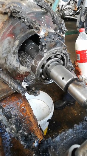 BEARING IN HOLDING STEADY TURNING SHAFT TO CUT THROUGH EXCAVATOR DIPPER STICK AFTER MIG WELDING