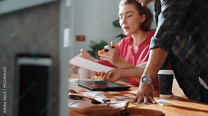 Smart project manager working together with businessman choosing logo design. Professional business team planning and discussing about marketing strategy while looking at color palettes. Symposium.