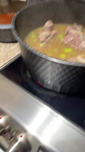 Cooking Delicious Stew with Meat and Green Vegetables
