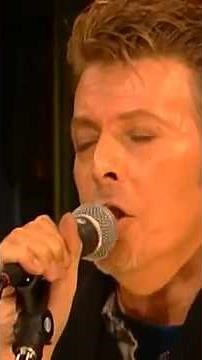 David Bowie sings his evocative song Under Pressure in 1996