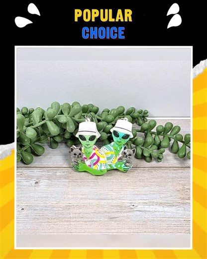 Beachside Bits NSB | High-quality, Affordable Jewelry on Instagram: "🚀 Get ready to catapult your style into another galaxy! 🌌✨ These Holographic Alien Cat Earrings are not just accessories; they’re a conversation starter! 😻 Crafted from quirky acrylic, they sparkle and shine with every move, adding a pop of color to any outfit. Whether you're dressing up for a party or rocking a casual day look, these playful jewels will have you feeling confident and fun! Pair them with your favorite tee or