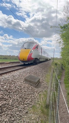 Azuma close up passes Tuxford at speed, with 2 tone