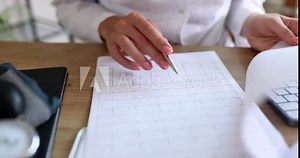 Cardiologist examines patient heart disease and electrocardiogram. ECG description of norm and signs of pathologies