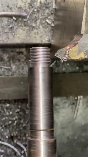 Threading process in metal shaft in diamond tool in lathe machine