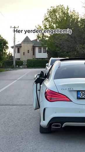 White Mercedes-Benz CLA 220 Parked in Suburban Area