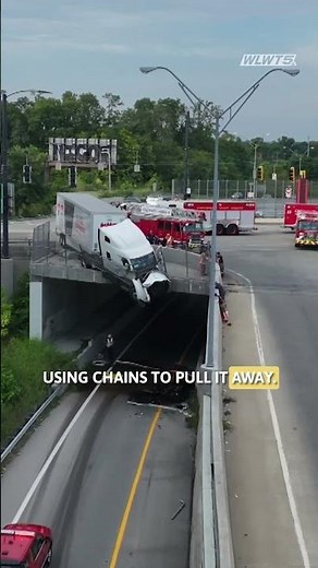 Road reopened after semi-truck hits barrier, dangles over I-71 in Cincinnati