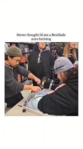 humourjoyusa on Instagram: "This video captures an impressive and high-energy Beyblade battle that has gone viral for its "dramatic" and high-skill gameplay. Video Summary The clip shows two players launching their Beyblades into a large, transparent stadium. One player, in particular, demonstrates incredible skill by launching his Beyblade in a way that it maintains extreme speed and stability. The video is captioned with the phrase "Never thought I’d see a Beyblade aura farming," which is inte