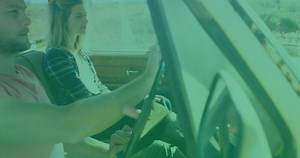 Animation of digital data processing over two caucasian people in car. Global connections, data processing and digital interface concept digitally generated video.