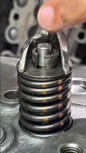 Removing and installing engine valves using a valve spring compressor. #mechanic #mechaniclife