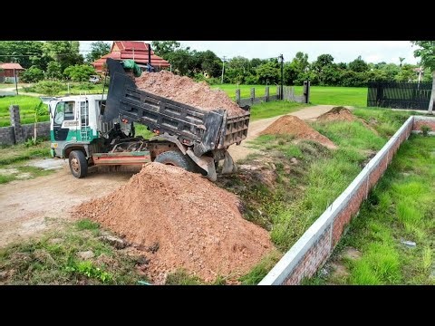 Dropping soil to clean weeds around the pond. and buried soil to protect the fence foundation