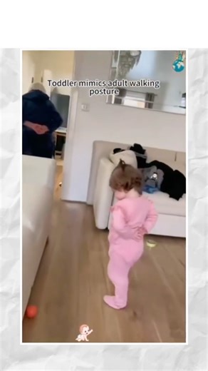 Toddler mimics adult walking posture.. 🤭