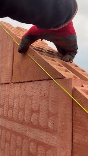 the process of installing triangular bricks to make roof walls #construction #brick #shorts