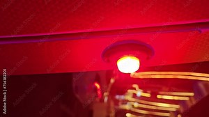 vertical video: A flashing ambulance light for emergency service at night