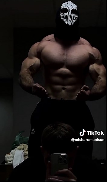 Muscular Fitness Showcase in Dramatic Lighting