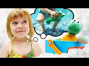 Baby toys & water toys at the swimming pool. Water slides & family fun for kids.