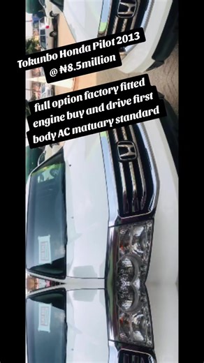 This white beautiful 2013 Honda Pilot Touring has just arrived at Headline Cars direct from the USA. Equipped with ALL WHEEL DRIVE capabilities, this vehicle comes with many features such as power windows, locks, and side mirrors, leather and heated seats, moon-roof, fog lamps, Bluetooth, usb port, alloy wheels ,Navigation, DVD entertainment and so much more. The Touring trim includes roof rails, parking sensors, a voice-activated navigation system, a rear DVD entertainment system makes the most