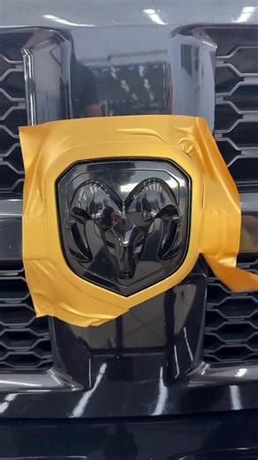 PolonezGarage on Instagram: "Gold Shield Contour! | Front Emblem Accent | Dodge RAM This totally black Dodge RAM has a massive front Aries emblem — but on an all-black truck, it disappears into the grille. So in this tutorial, we give it a gold contour shield using a simple, safe, zero-risk vinyl wrapping method. A thin gold outline around the emblem creates insane contrast and transforms the entire front end. Fast, clean, and beginner-friendly. 📋 Step-by-step process: 🛑 Remove the front Aries