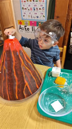 Idyllwild Montessori School on Instagram: "IMS Science Fair project - Volcano Eruption. A Montessori volcano eruption is a classic hands-on science experiment using baking soda, vinegar, food coloring, contained in a special volcano model, demonstrating the chemical reaction that creates gas and "lava" foam, teaching earth science, chemical reactions, and encouraging observation. We also watched a real volcano eruption video, so our students address it to the experiment. #volcanoeruption #scienc