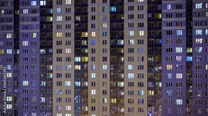 night window timelapse. architecture of the night city, urbanistic view of the building.