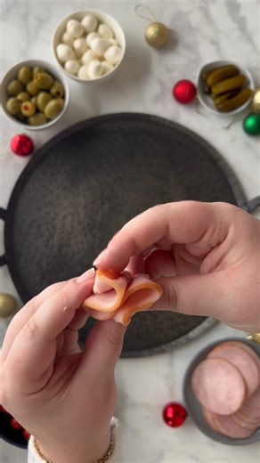 A shareable protein skewer is perfect for a party or get together. Stack canadian bacon slices with cherry tomatoes, green olives or pickles, and mozzarella balls. Easy, flavorful, and gluten free! | Jones Dairy Farm