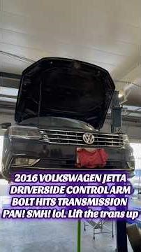 2016 VW Jetta Driver side lower control arm bolt hits transmission pan. Lift up the transmission pan