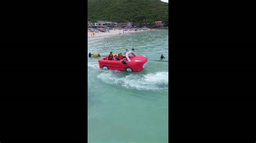 Inflatable beach ride is shaped like a convertible car