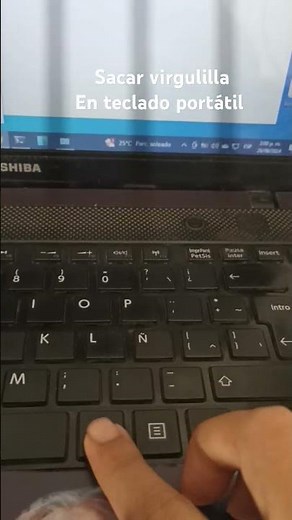 virgulilla en teclado portátil
