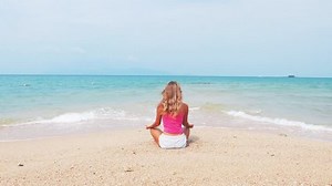 Woman Doing Meditation Near Ocean Beach Stock Footage Video (100% Royalty-free) 14446747 | Shutterstock
