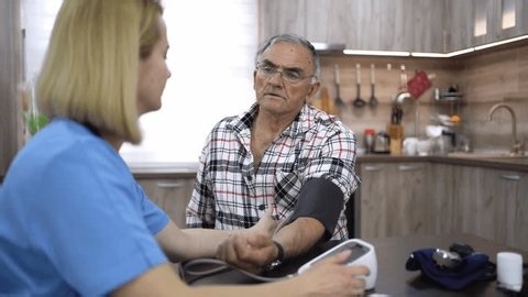 clip-3991881291-nurse-measuring-blood-pressure-senior-man-home