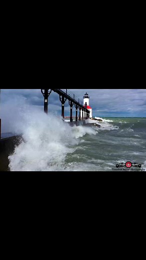 3.9K views · 209 reactions | Big Waves Rolling Over Michigan Lighthouse & Pier Soaks Drone | Timeless Aerial Photography | Facebook