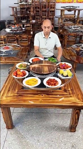 farmhouse-style dining table featuring an integrated, rotating, multifunctional hot pot