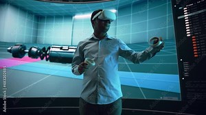 Automotive Engineer Using a VR Software to Showcase Electric Motor and Vehicle Platform in Interactive Environment on a Big Digital Screen. Multiethnic Male Engineer Using Headset and Controllers.