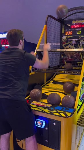 Basketball Arcade Game Challenge: Young Man Scores Big