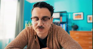 Professional handsome vlogger, influencer, blogger with glasses record videos for social media, talk to friends on video camera on phone, break from work, responsibilities, wave to camera to say hello