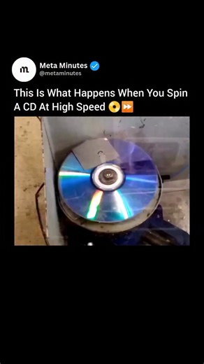 Meta Minutes on Instagram: "When a CD spins at extreme speed, light dances across its surface in flashes of rainbow color. The smooth plastic becomes a canvas for diffraction, scattering light into dazzling hues. As the speed increases, the disc seems to melt into a blur of motion. The reflections swirl together, forming a bright ring that shimmers like liquid glass. Up close, the tiny pits that hold digital data appear to ripple like waves. Each rotation bends the light just enough to make the 