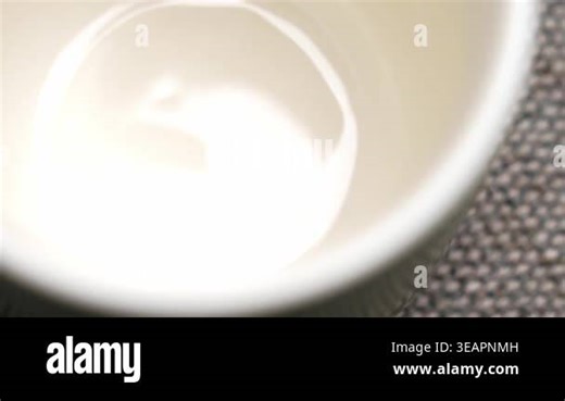 Spoon with granulated chicory powder falling into an empty ceramic mug in close up. Dry instant drink ingredient of caffeine free beverage Stock Video Footage - Alamy