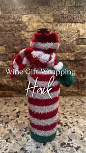 Wine wrapping hack! Grab a pair of fuzzy socks and it’s a 2 in 1 gift then! #giftwrappinghacks #christmaswrap #wrappinghack #giftgiving | Bullseye on the Bargain