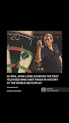 John Lowe made sporting history by recording the first perfect nine-dart finish ever captured on television. Often described as having the "eyes of a sniper and hands of a surgeon" for his incredible precision, the former carpenter defeated Keith Deller with a flawless 501 checkout. This feat earned him a record £102,000 bonus and solidified his status as "Old Stone Face," one of the most composed and iconic legends in professional darts. | History In Pictures
