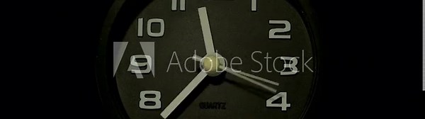 Tme lapse video of a clock time passing over a day to night on black background.