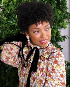 Logan Browning wearing our FW19 Ruffle Blouse, Cropped Jeans, Lee Radziwill Bag and Lila Boots at our #ToryBurchSS20 runway show #ToryBurch #NYFW | TORY BURCH