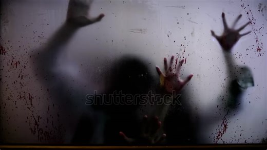 stock-footage-blurry-zombie-hands-claw-at-blood-splattered-window-eerie-presence-of-zombies-haunting-visual