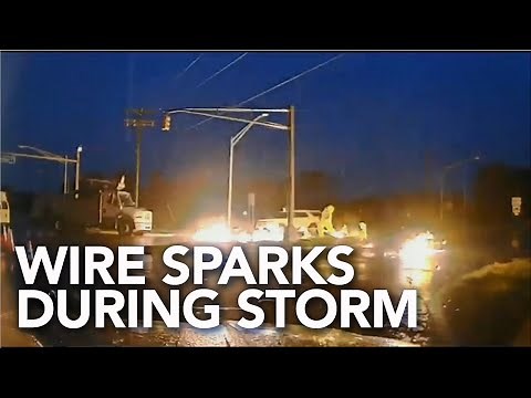 Shocking video shows moment live wire catches fire during storm
