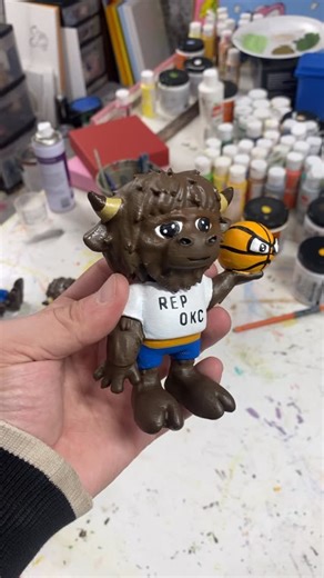 Thrumyeyez ™ on Instagram: "Never thought I’d be doing this..🔥 A couple weeks ago the @okcthunder reached out to me about potentially making 20 rumble the bison figs with a character face on the ball, it came with a tight dead line but managed to complete and make it happen! From designing this figure, paintings, and managing a small team this project was definitely one of my favorites. Special thanks to the team that helped make this project happen: @dawnjaiye “Project Coordinator” @delovesrob