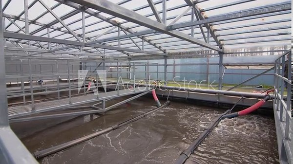 Aerotank full of water with addition of activated sludge for removal of dirt. Final stage of wastewater aeration before chlorination