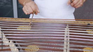 Playing stringed instrument. Hammered dulcimer close up. Leisure and hobby concept. Meditation music. Musician playing hammered dulcimer close-up. Stringed percussion musical instrument sounds good