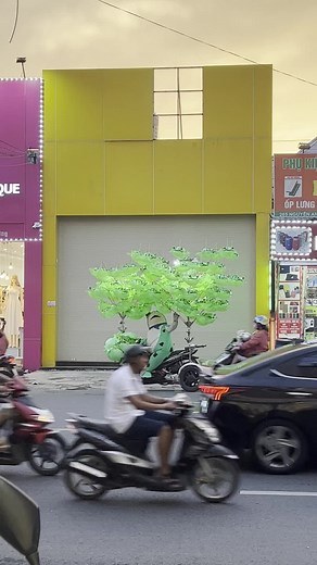Urban Scene with Frog Costume and Artificial Tree